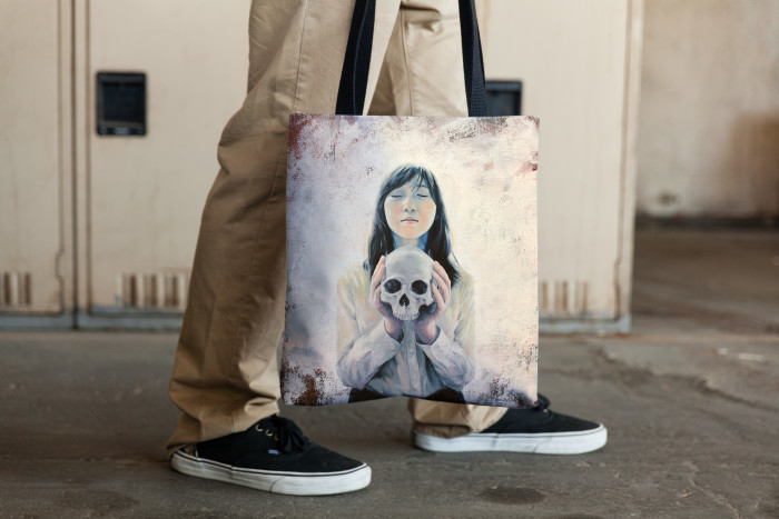 Tote bag mockup - girl holding a skull