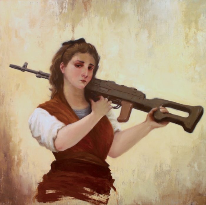 Guerrilla woman holding a machine gun on her shoulder