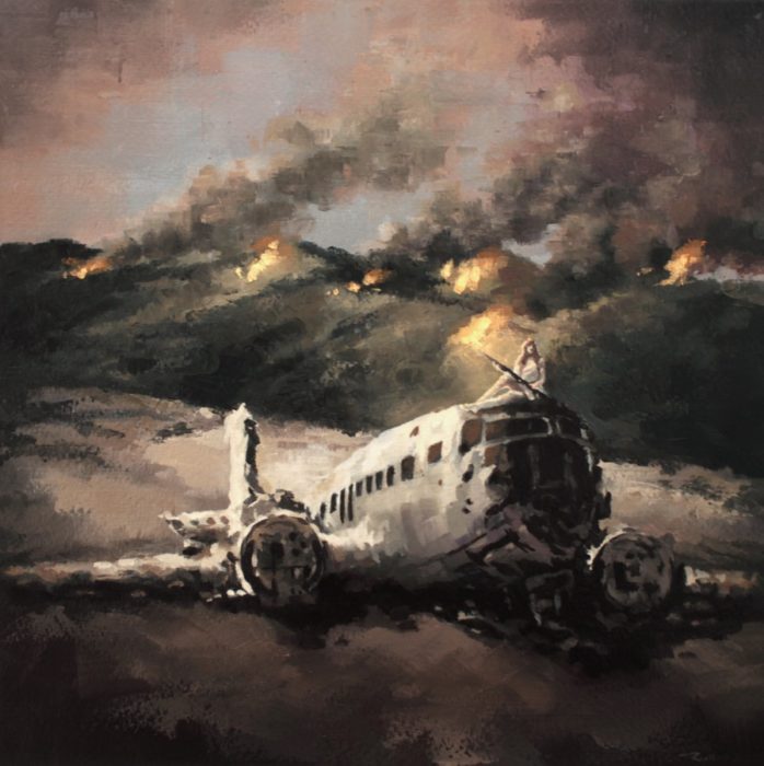 Woman holding a rifle sitting on a crached airplane in burning mountains